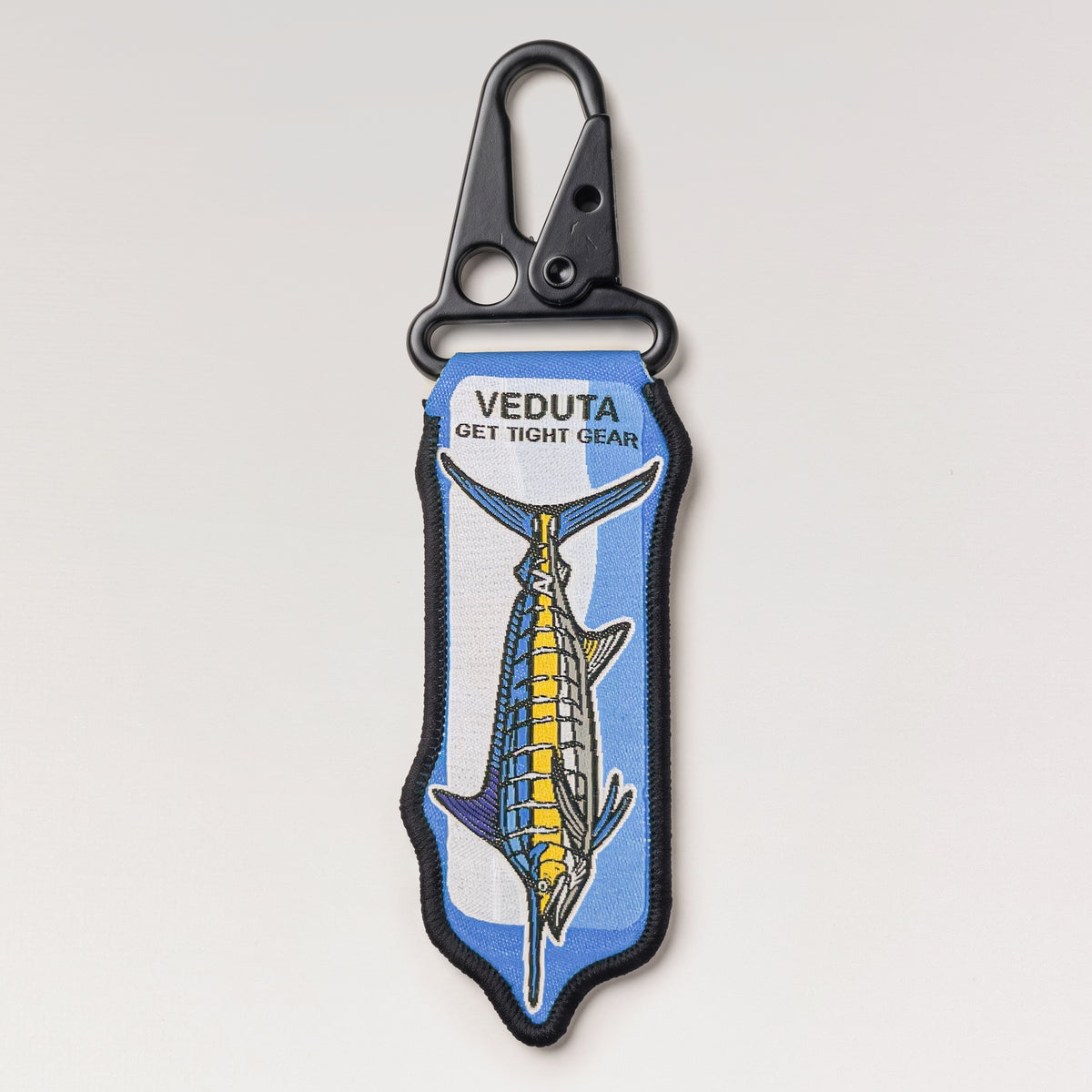 Back of the Blue Marlin woven keychain with VEDUTA x Get Tight Gear woven logo