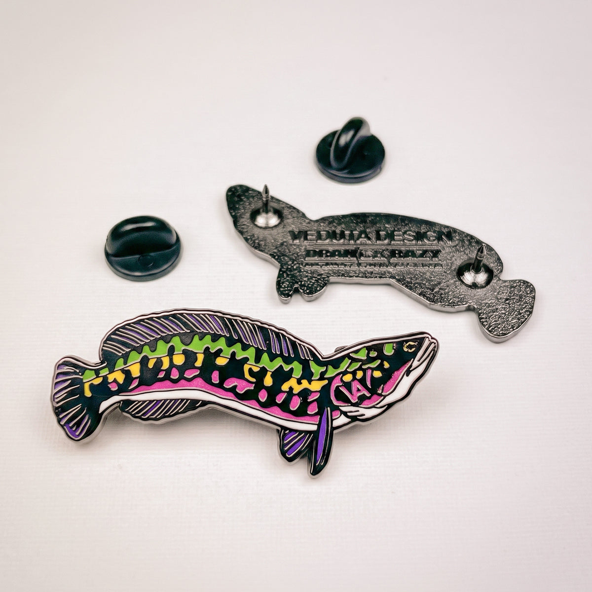 Giant Snakehead pin with clutch backs and branded backing card