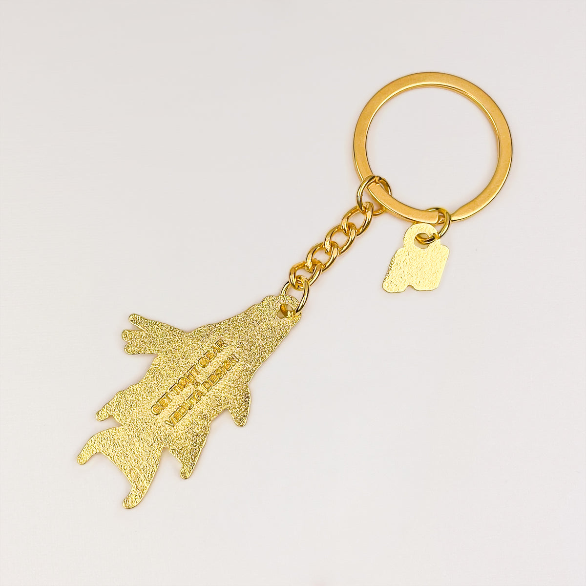 Back of the Hogfish keychain charm with embossed VEDUTA DESIGN logo