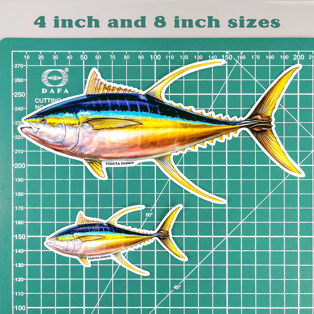 Yellowfin Tuna stickers in 4-inch and 8-inch sizes shown on a cutting mat for size reference