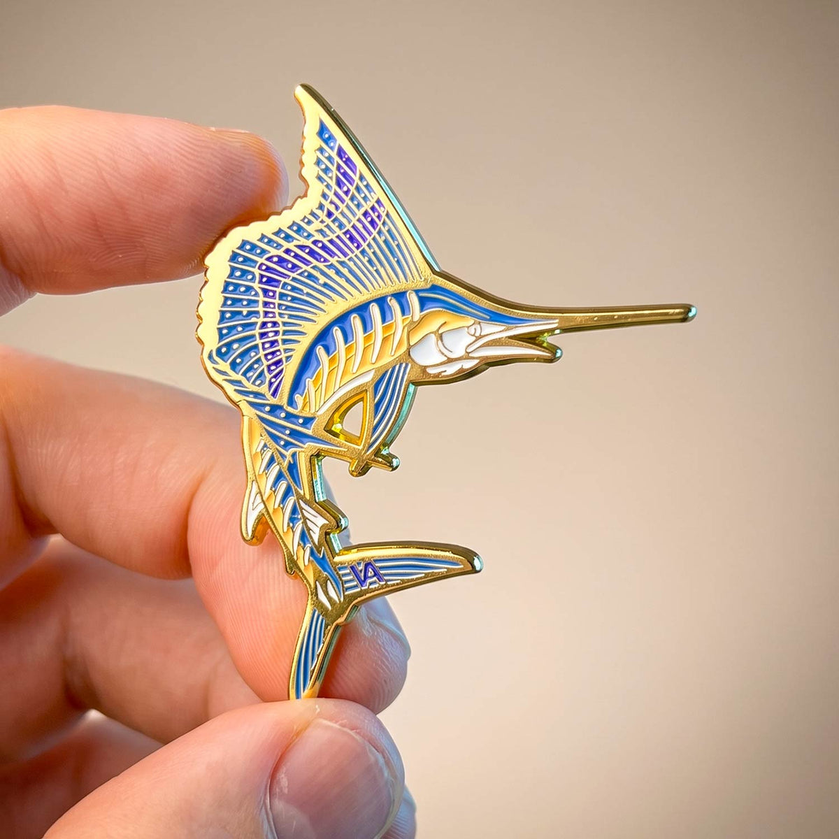 Collectible fishing enamel pins from VEDUTA DESIGN for hats, vests, tackle bags and lanyards