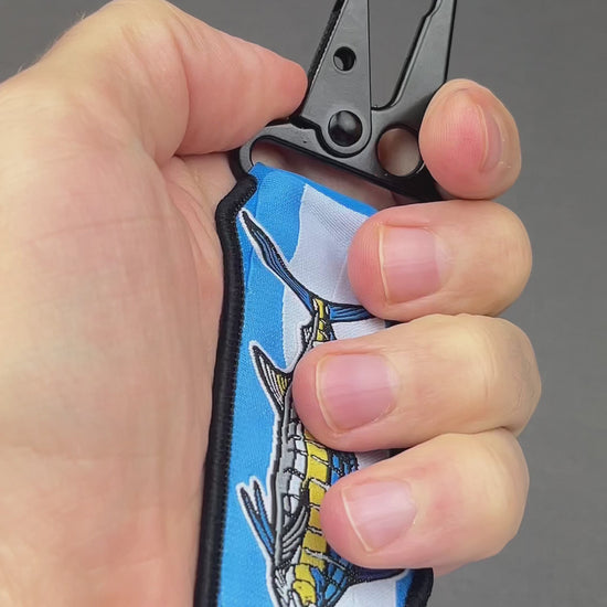 Video of the Blue Marlin woven keychain with jacquard fabric tag and black carabiner clip