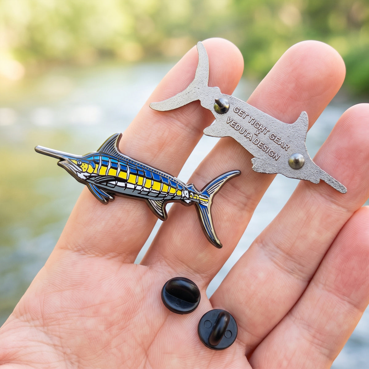 Blue Marlin pin front and back with two black rubber clutch backs, Get Tight Gear x VEDUTA DESIGN logo embossed on the back