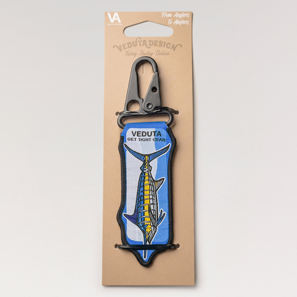 Blue Marlin woven keychain on branded VEDUTA DESIGN cardboard hang-tab packaging