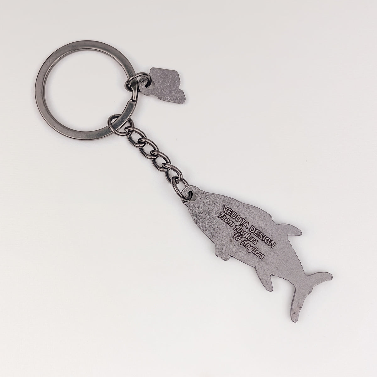 Back of the Bluefin Tuna keychain charm with embossed VEDUTA DESIGN logo