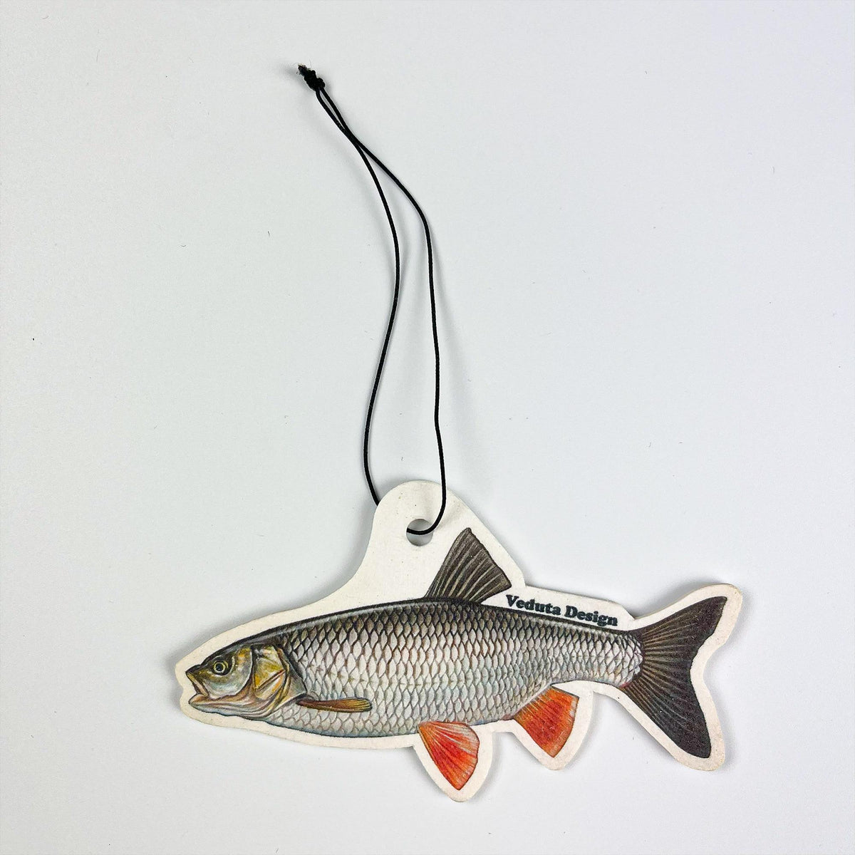 Chub air freshener with hanging cord on a light background
