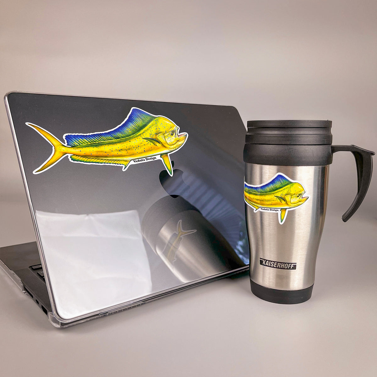 Dolphinfish sticker on a laptop and travel mug, offshore fishing decal