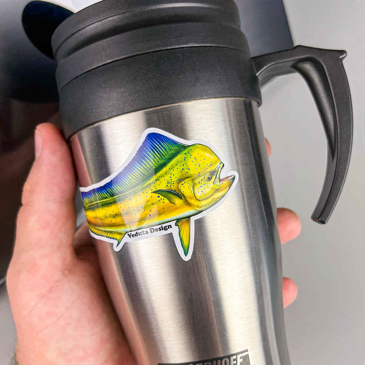 Dolphinfish sticker applied to a stainless steel travel mug