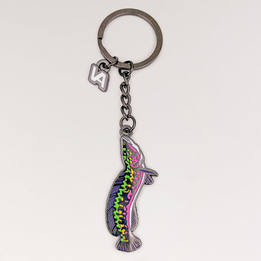 Giant Snakehead keychain, black nickel hard enamel charm with the VEDUTA DESIGN VA logo charm and chain, on a light studio background
