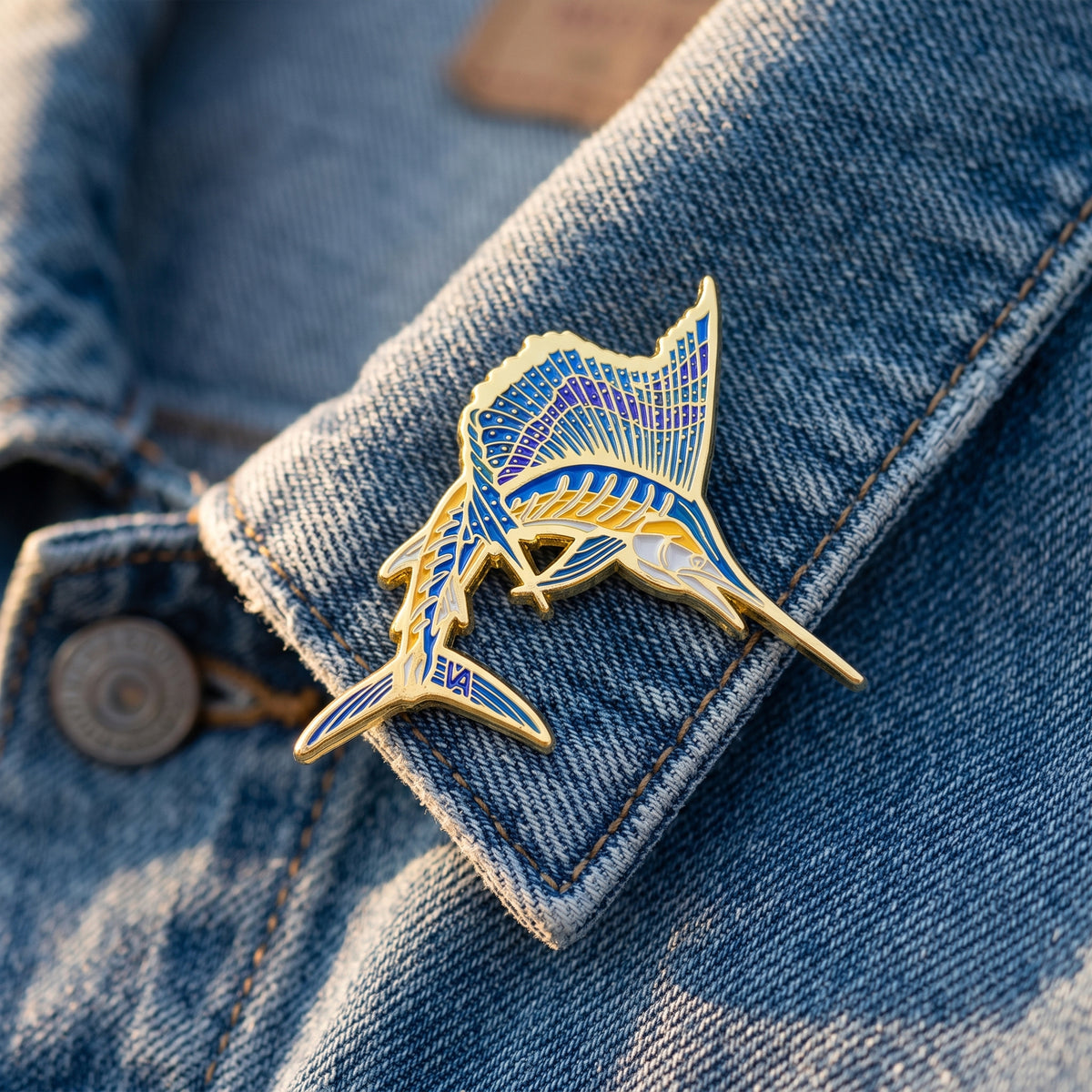 Sailfish pin on a denim jacket cuff