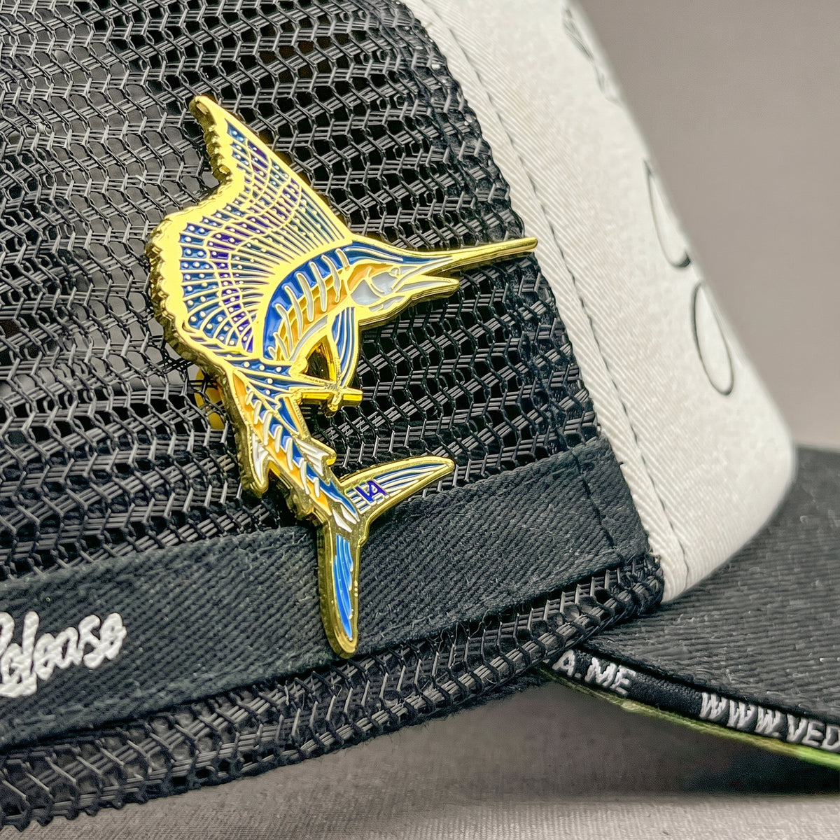 Sailfish pin on a fishing cap