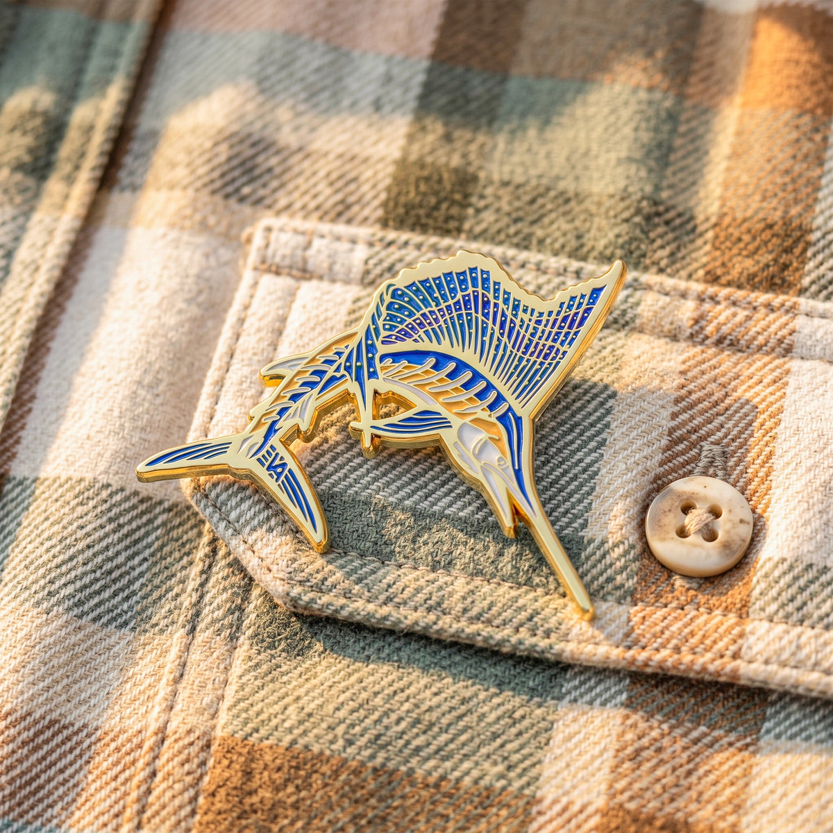 Sailfish pin on a flannel shirt pocket