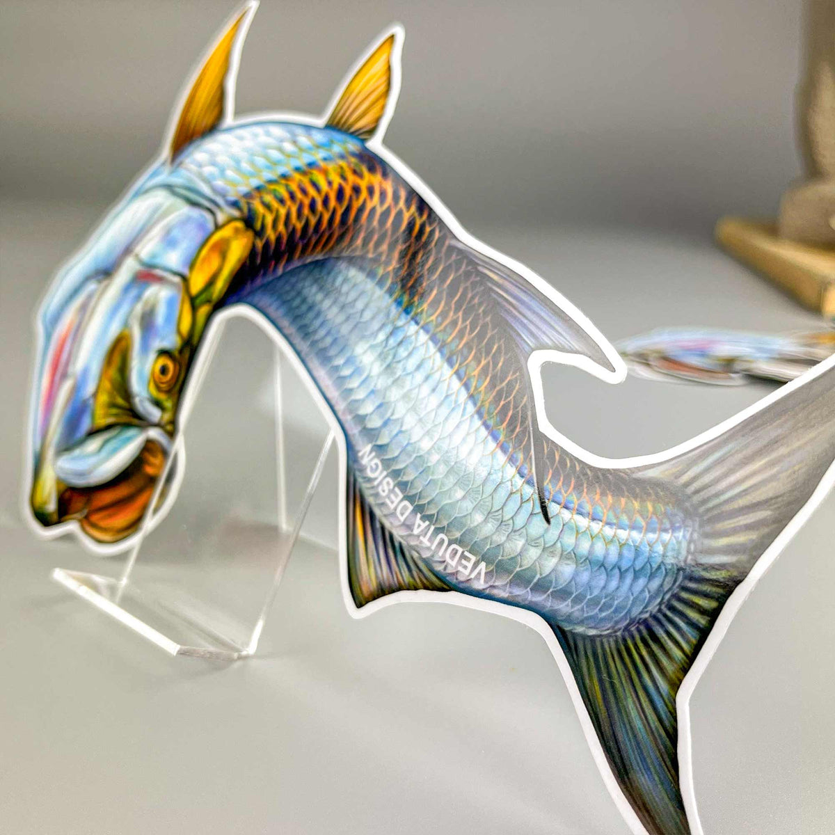 Leaping Tarpon sticker on a display stand, fly fishing decal of the Silver King mid-jump
