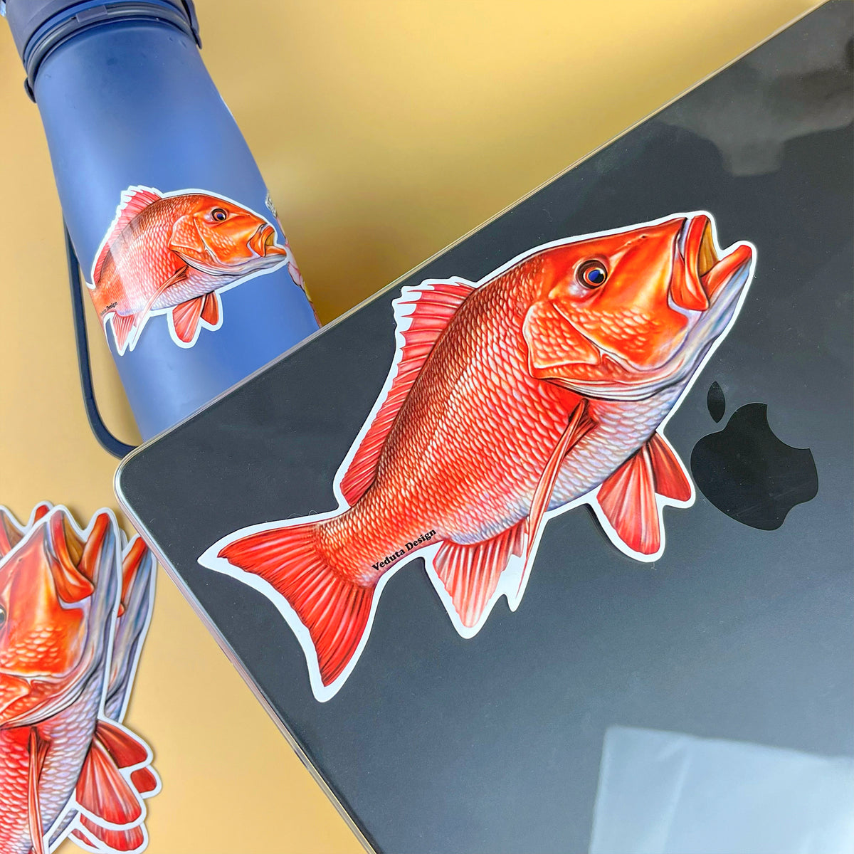 Red Snapper stickers applied to a water bottle and laptop, VEDUTA DESIGN fishing decal