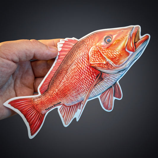 Red Snapper vinyl sticker held in hand against a dark background