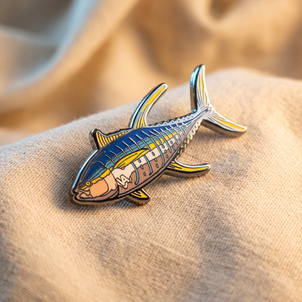 Black nickel Yellowfin Tuna enamel pin on canvas fabric